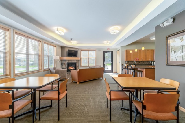 Community room dining and lounge area at The Aspen